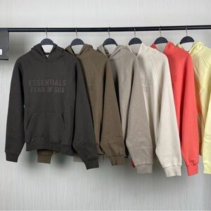 Fear of God Essentials Cream and Coral Sweatshirts